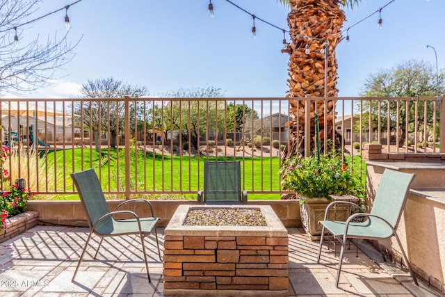 view of patio / terrace with a fire pit