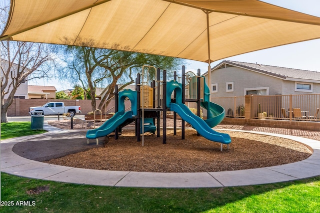 communal playground featuring fence