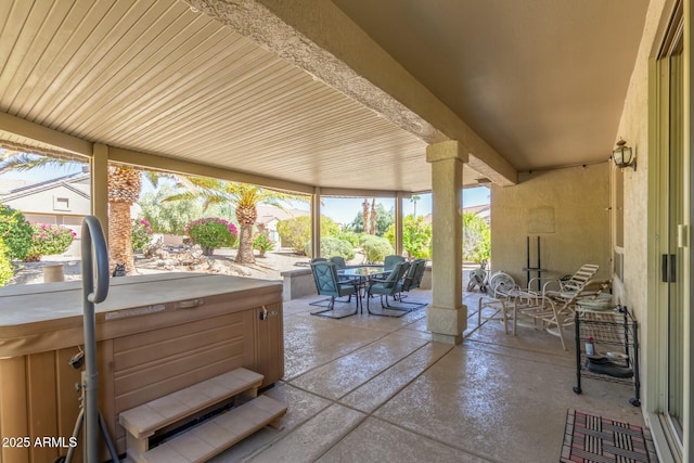 view of patio / terrace featuring a hot tub