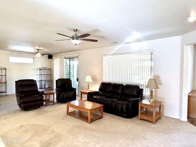 living room featuring ceiling fan and light carpet