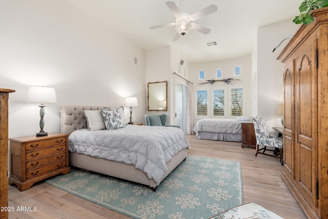 bedroom featuring a ceiling fan, light wood-type flooring, and visible vents