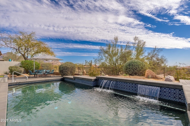 view of pool featuring a patio, outdoor lounge area, a fenced backyard, and a fenced in pool