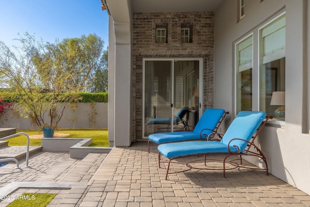 view of patio / terrace featuring fence