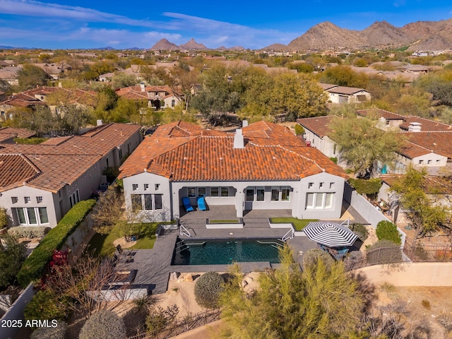 birds eye view of property with a residential view and a mountain view