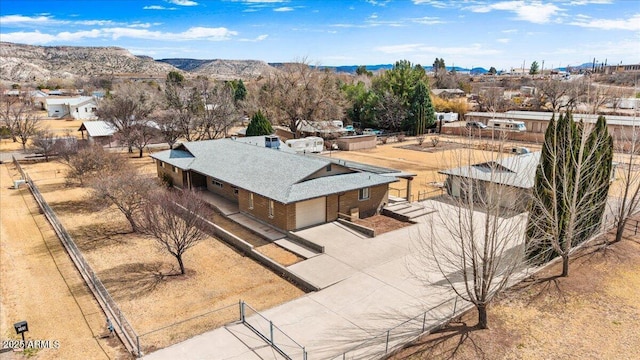 birds eye view of property featuring a mountain view