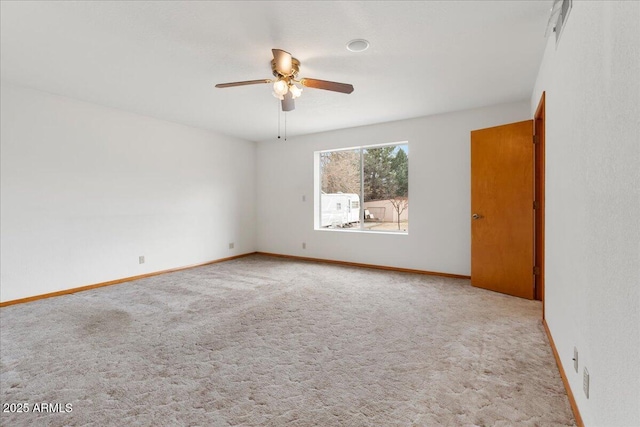 unfurnished room featuring ceiling fan, carpet floors, and baseboards