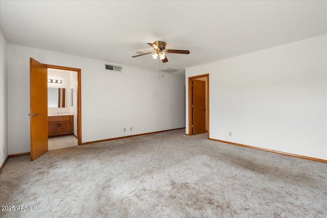 empty room featuring carpet, visible vents, ceiling fan, and baseboards