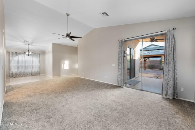 unfurnished room with carpet floors and lofted ceiling