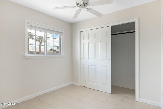 unfurnished bedroom featuring a closet, ceiling fan, and baseboards