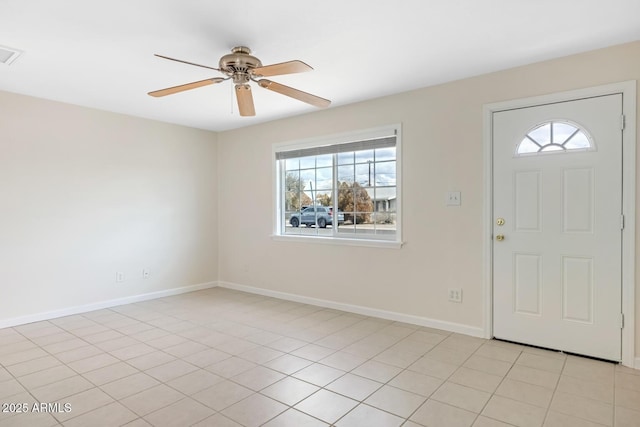 foyer with visible vents, baseboards, ceiling fan, and light tile patterned flooring