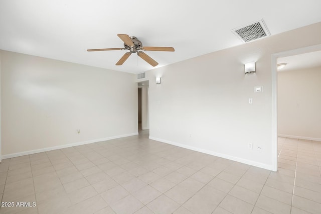 unfurnished room with light tile patterned floors, visible vents, baseboards, and ceiling fan