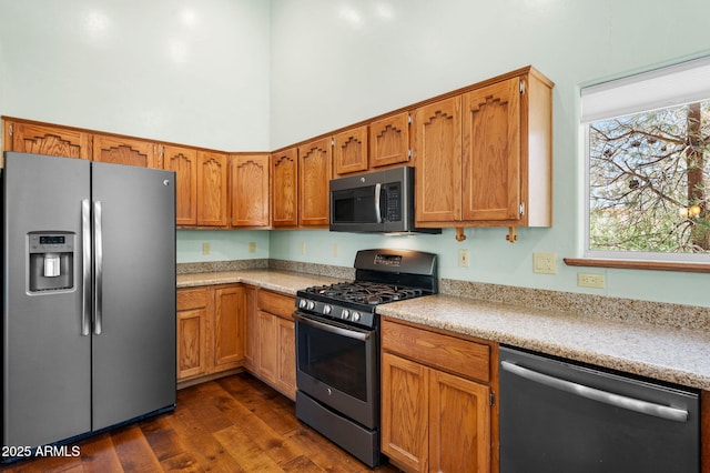 1405 Eagle Ridge Rd, Prescott, AZ 86301 - kitchen featuring stainless steel appliances, dark wood-style flooring, brown cabinets, and a high ceiling