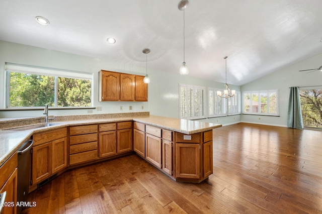 1405 Eagle Ridge Rd, Prescott, AZ 86301 - kitchen with brown cabinets, vaulted ceiling, dark wood-type flooring, stainless steel dishwasher, and a sink