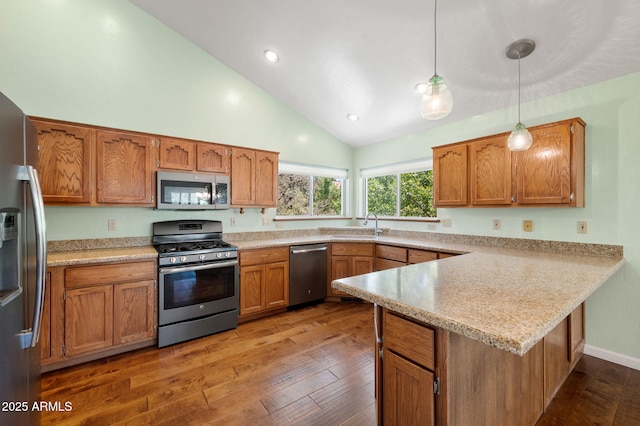 1405 Eagle Ridge Rd, Prescott, AZ 86301 - kitchen with appliances with stainless steel finishes, a peninsula, light countertops, light wood-style floors, and high vaulted ceiling
