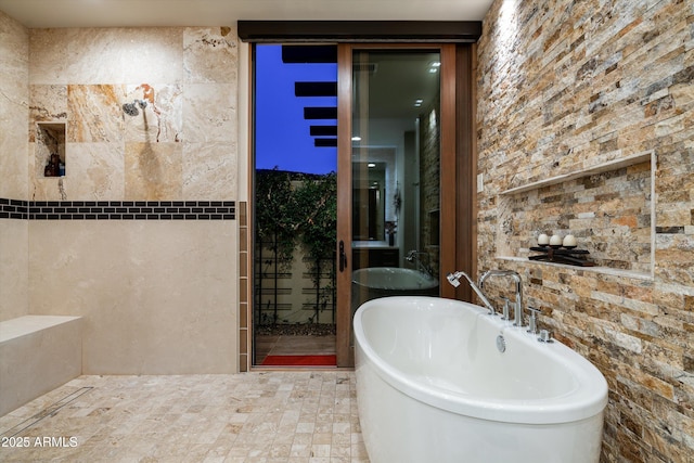 bathroom with a tub to relax in