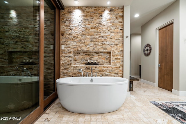 bathroom featuring a washtub