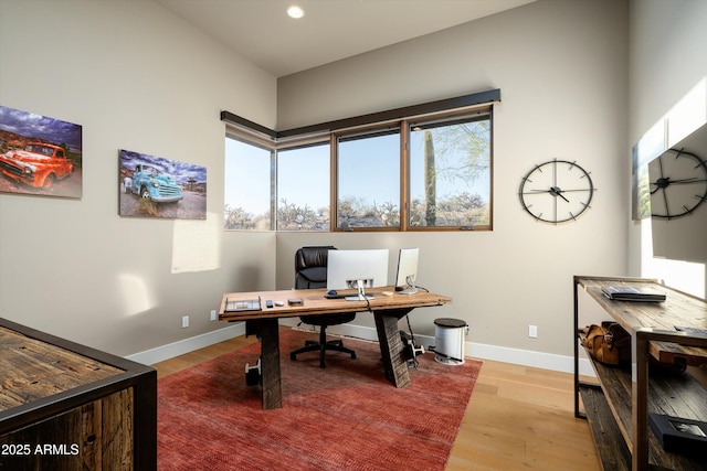 office area with light hardwood / wood-style flooring