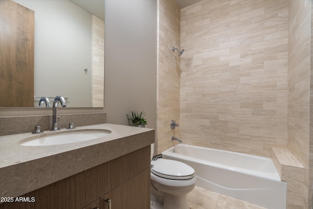 full bathroom featuring vanity, tile patterned flooring, tiled shower / bath combo, and toilet