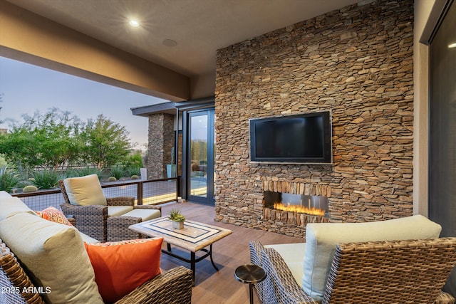 view of patio / terrace featuring an outdoor living space with a fireplace