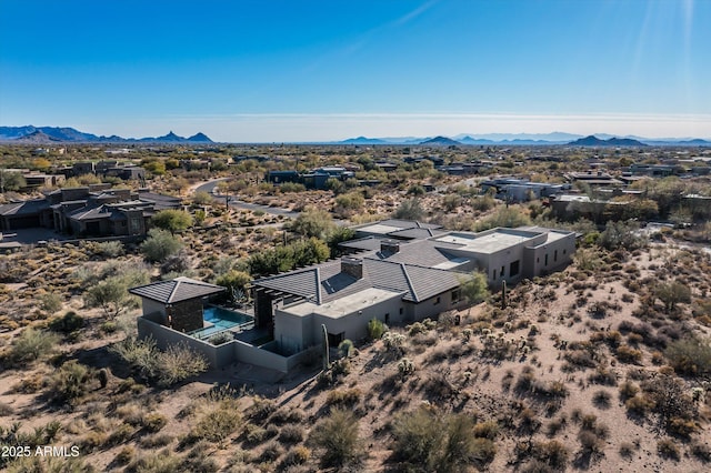 birds eye view of property featuring a mountain view