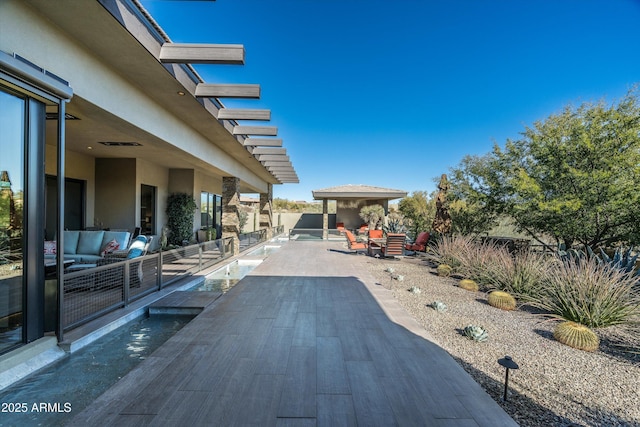 exterior space featuring an outdoor living space and a patio