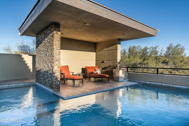 view of pool featuring a patio