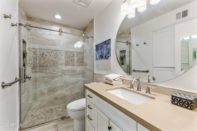 bathroom with visible vents, a shower stall, and toilet