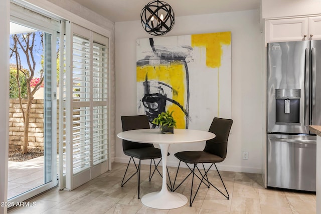 dining space featuring baseboards