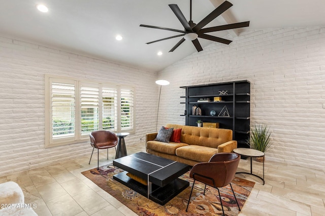 living area featuring high vaulted ceiling, recessed lighting, ceiling fan, and brick wall