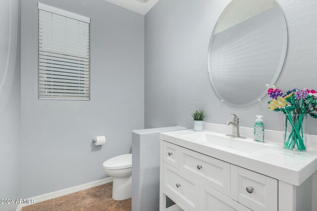 bathroom with vanity and toilet