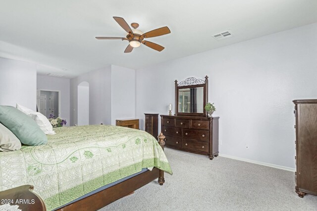 bedroom featuring ceiling fan and light carpet