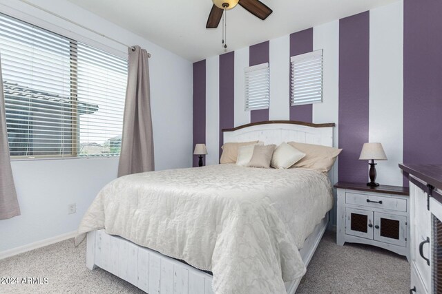 bedroom featuring ceiling fan and light colored carpet