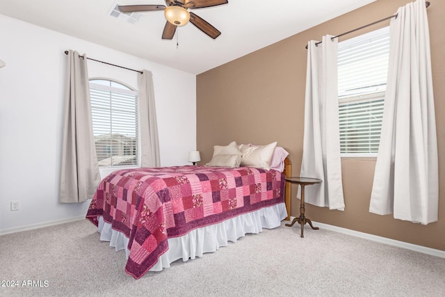 bedroom with ceiling fan and carpet