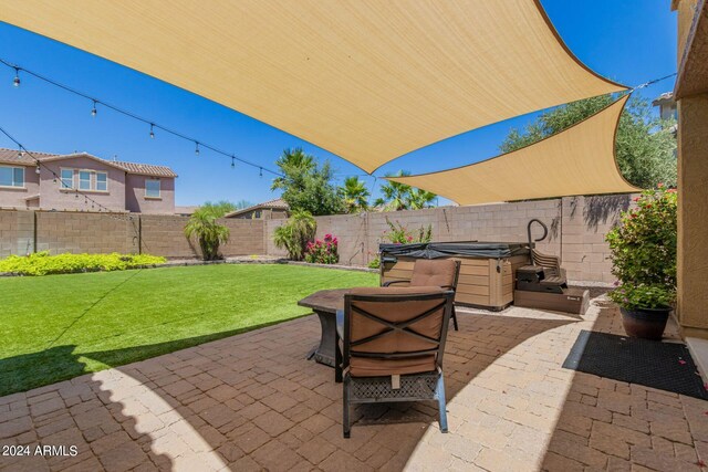 view of patio with a hot tub