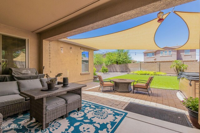 view of patio / terrace with an outdoor fire pit