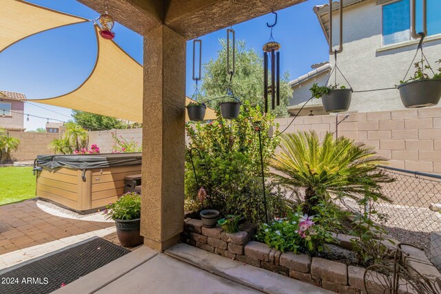 view of patio with a hot tub