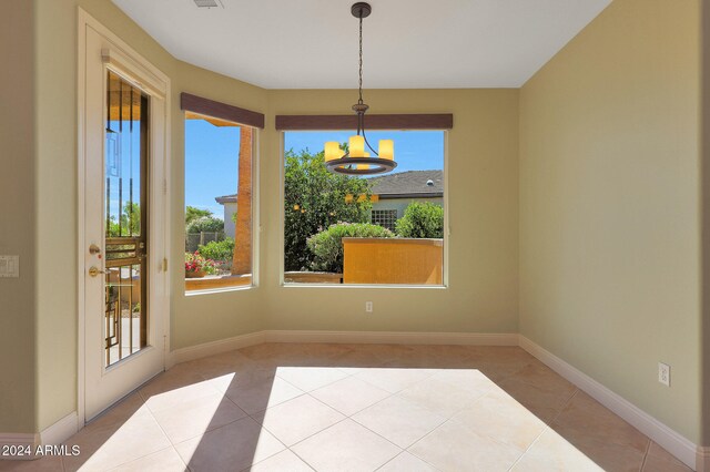 dining space with a healthy amount of sunlight and light tile patterned flooring