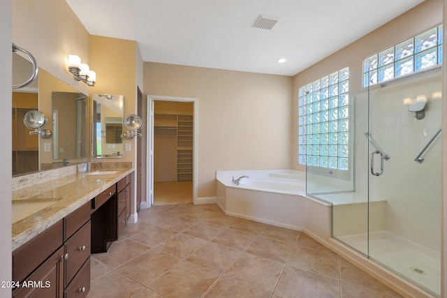 bathroom with vanity, shower with separate bathtub, and tile patterned flooring