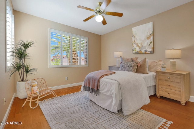 bedroom featuring hardwood / wood-style floors and ceiling fan