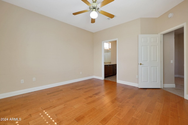 spare room featuring light hardwood / wood-style floors and ceiling fan