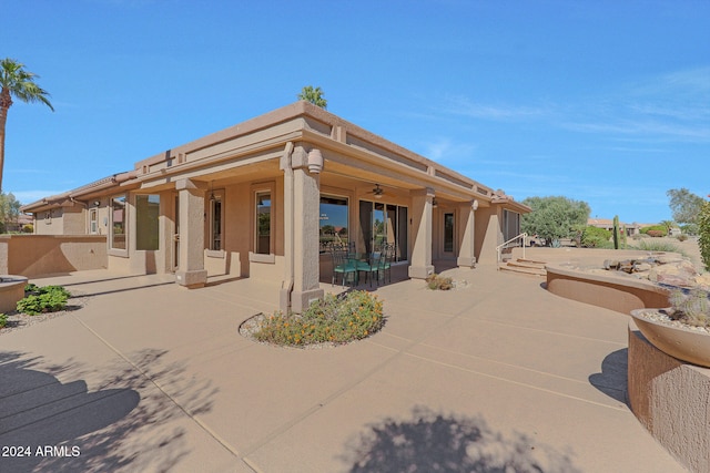 back of house featuring a patio area and ceiling fan