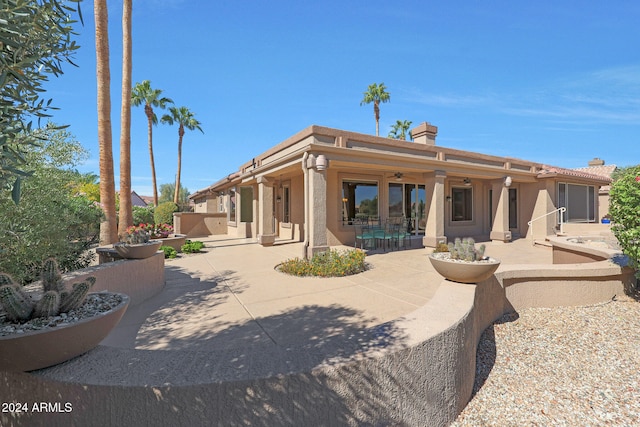 rear view of house featuring a patio