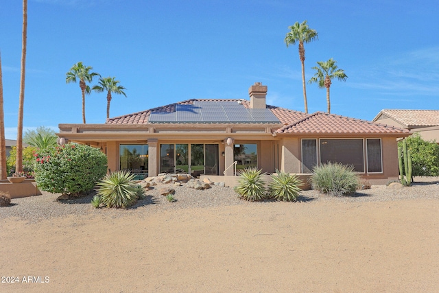 back of property with solar panels