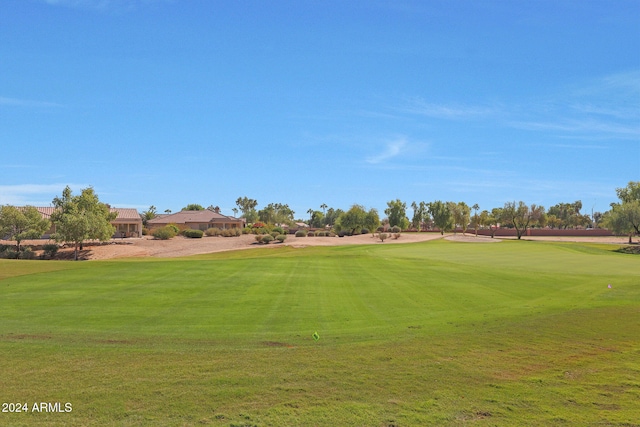 view of property's community featuring a yard