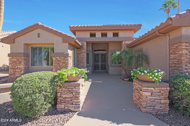 property entrance featuring a patio area