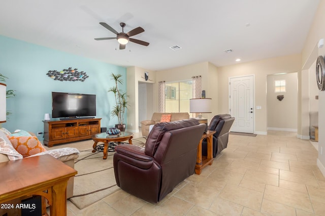 living room with light tile patterned floors and ceiling fan