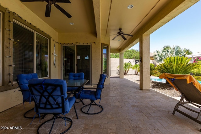 view of patio / terrace featuring ceiling fan