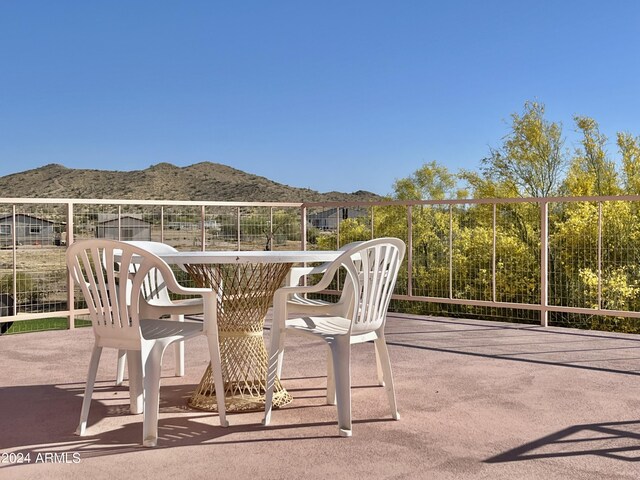 view of patio / terrace with a mountain view