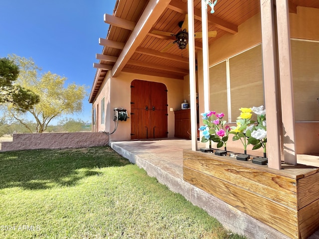 entrance to property with a yard