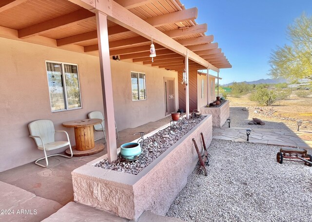 view of patio / terrace featuring a mountain view